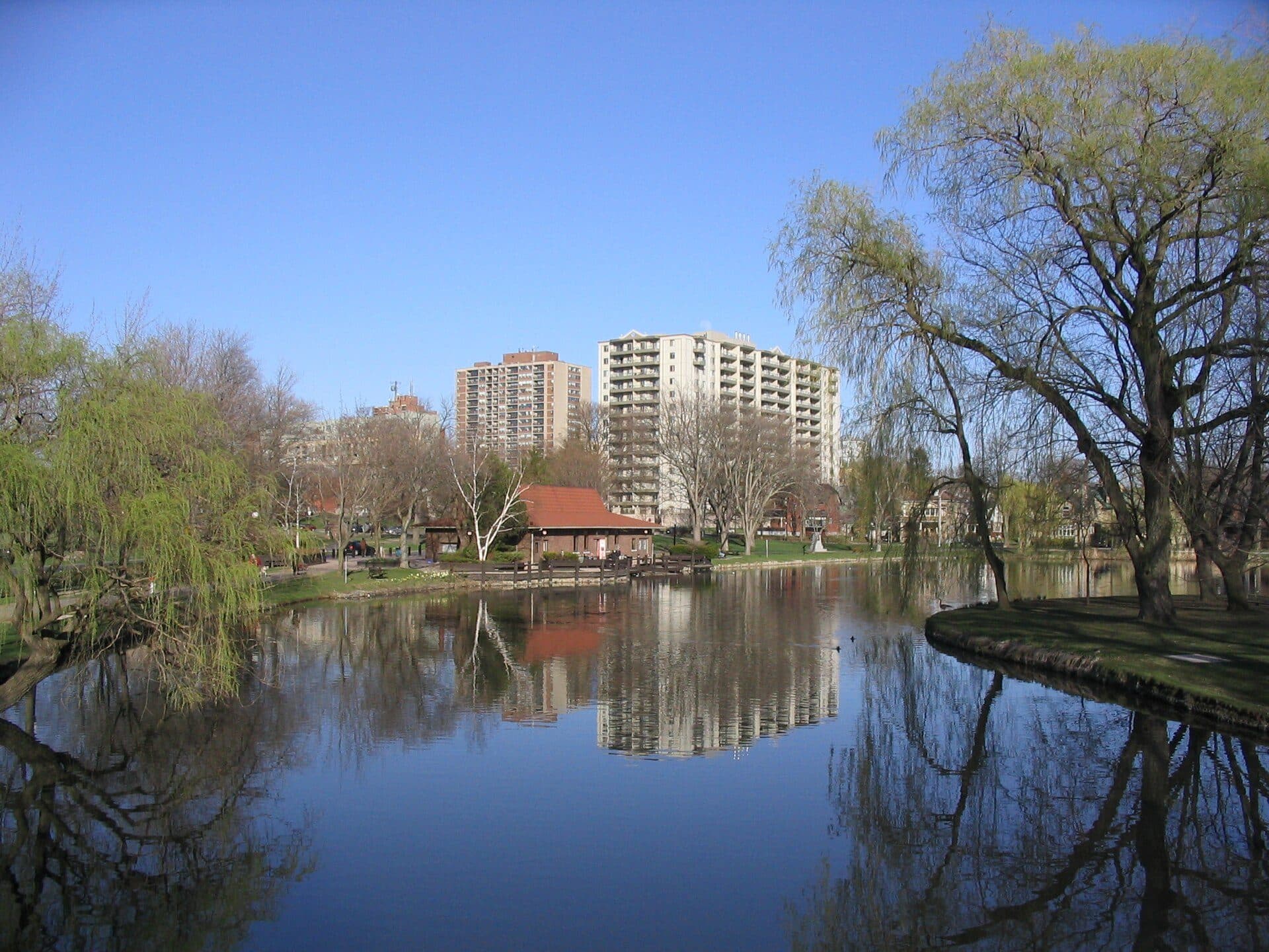 Victoria Park lake in spring, downtown Kitchener beyond